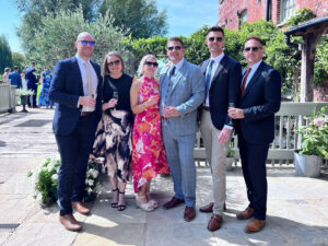 Wedding host mingling with guests at the drinks reception
