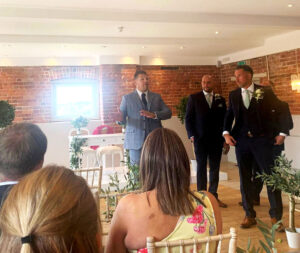 Wedding host addressing guests before the bride’s arrival at the ceremony
